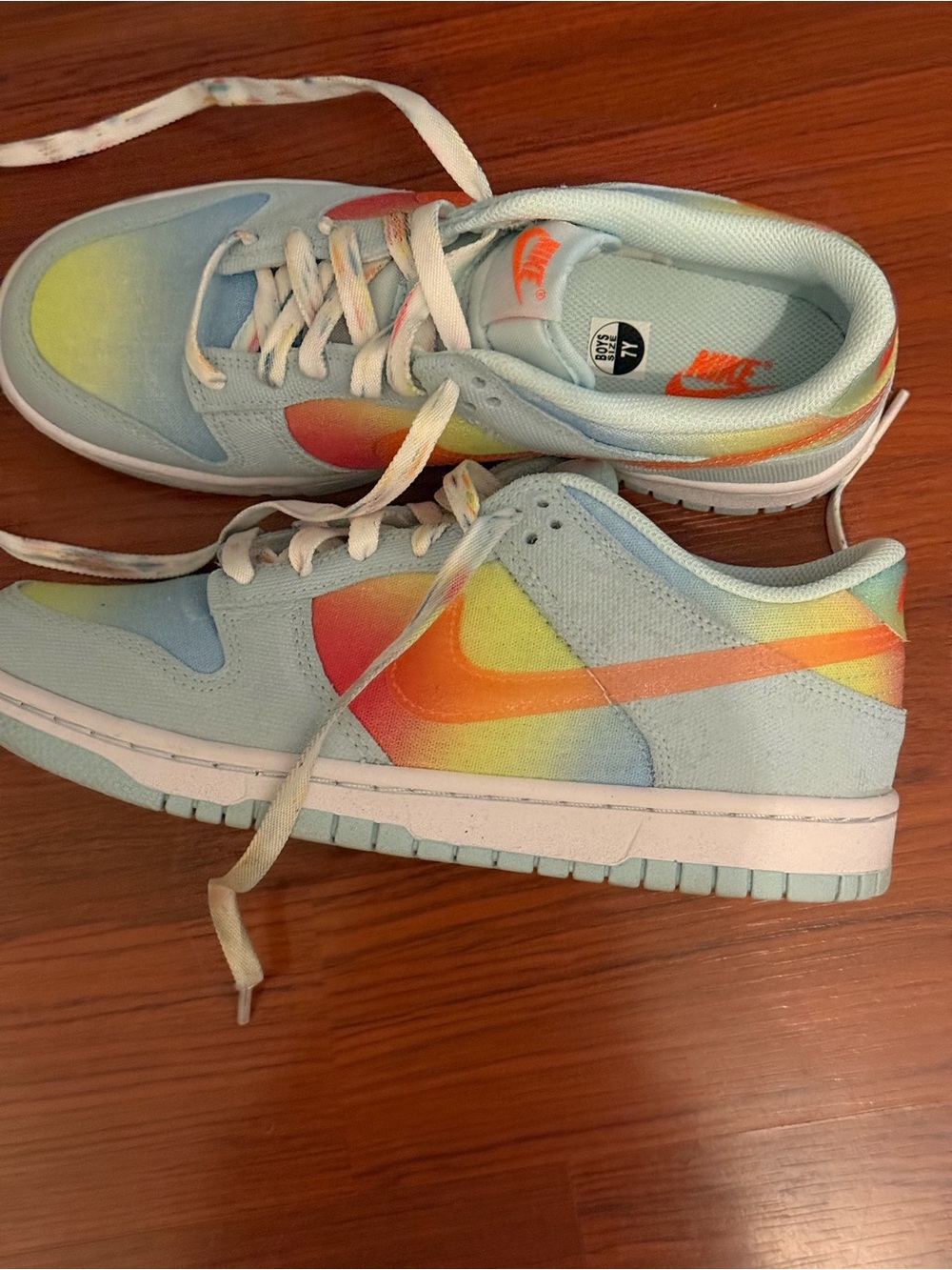 Nike Low-Top Sneakers in Light Blue with Rainbow Swoosh fit a woman 9